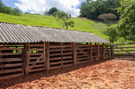 A Kind Of Barn On A Corral After A Heavy Rain With The Ground Full Of