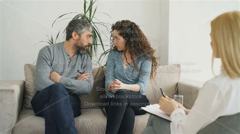 Married Couple Arguing And Quarreling During Visit Professional