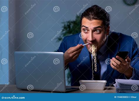 Hungry Employee Working Late In The Office Stock Image Image Of