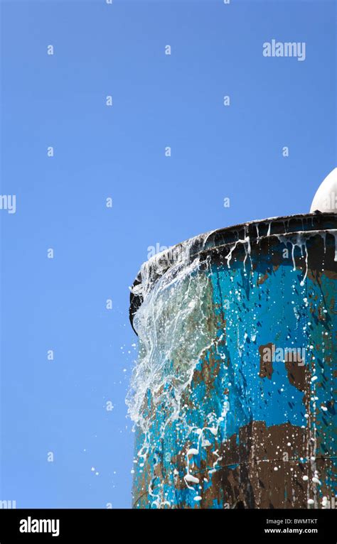 Water Overflowing From Industrial Tank Stock Photo Alamy