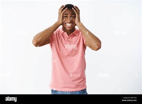 Guy Panicking Feeling Anxious And Scared Clenching Teeth Holding Hands On Head Stuck In