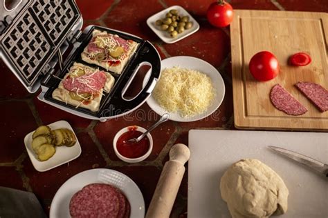 Cooking Waffles Stuffed With Sausage Cheese Pizza Waffle Piffle