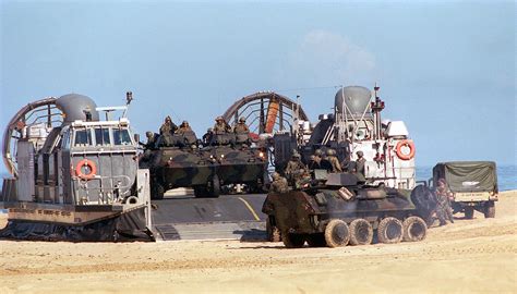 Us Marine Corps Light Armored Vehicles Lav 25 Roll Off The Deck Of A Us Navy Landing Craft Air