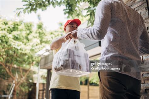 Delivery Man Bringing Food High Res Stock Photo Getty Images