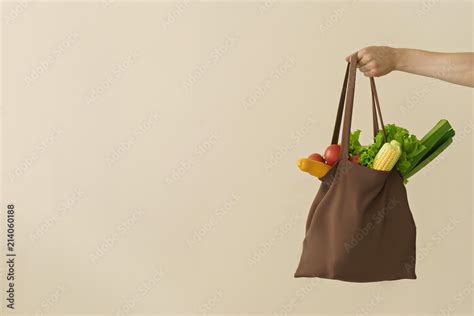 Man Hand Holding Cotton Grocery Bag With Vegetables Stock Photo Adobe