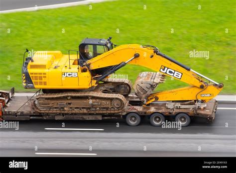 Excavator Jcb Truck Trailer Loaded Onto Cargo Platformon City Highway