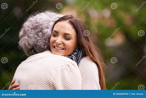 Embracing After A Long Time Apart An Attractive Woman And Her Senior