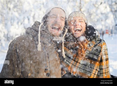 Couple Enjoying Snowfall Stock Photo Alamy