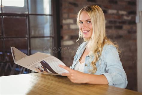 Smiling Blonde Holding Newspaper Stock Image Image Of Attractive Hair