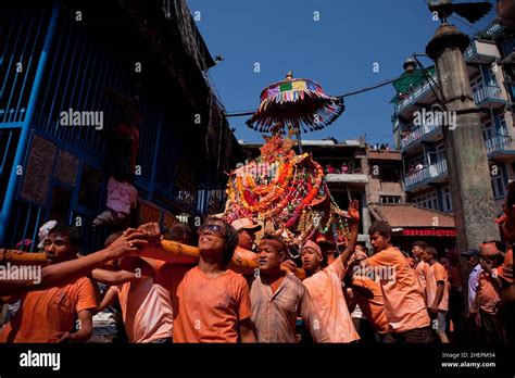 Crowd Carrying A Palanquin While Celebrating Sindoor Jatra Vermillion