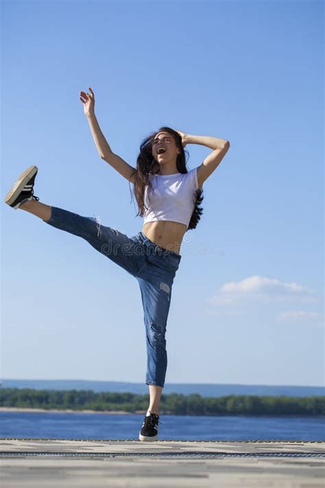 Young Beautiful Teenager Girl Posing Against Summer Park Bright Sunny