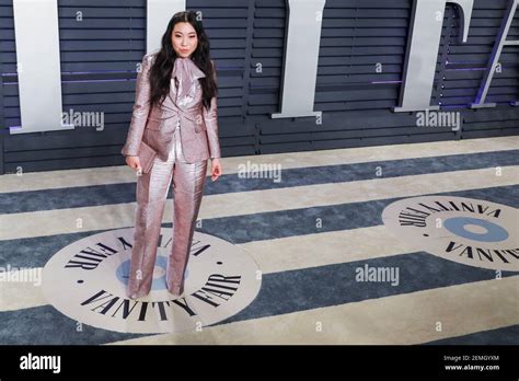 Awkwafina Walking On The Red Carpet At The 2019 Vanity Fair Oscar Party