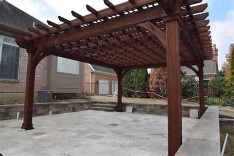 Stained Wood Pergola Over Pool Deck Featuring Impressive Columns And