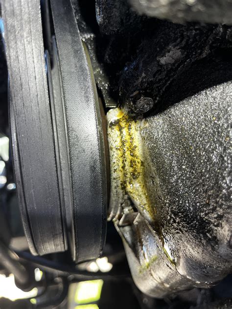 is this an front main seal oil leak? its dripping down to the front of