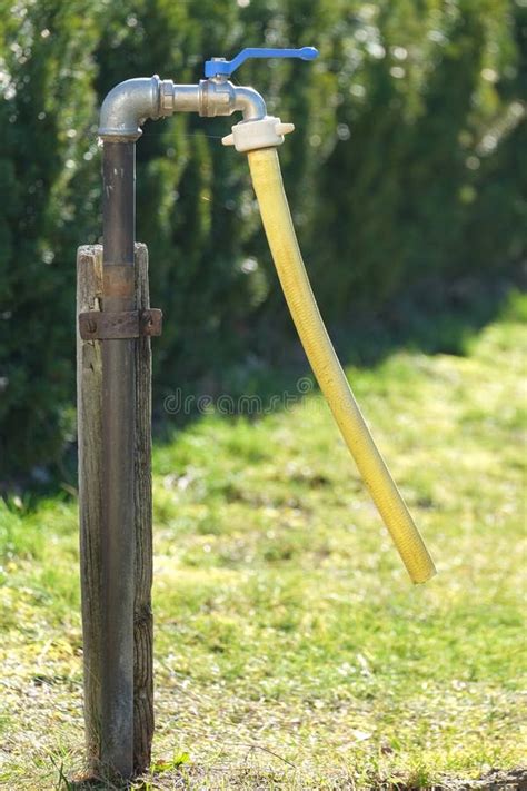 An Outdoor Faucet In The Garden Stock Image Image Of White Steel