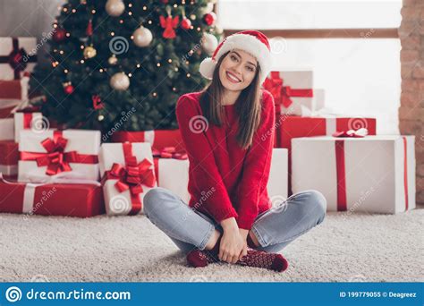 Photo Of Pretty Young Girl T Boxes Arms Hold Crossed Legs Wear Santa