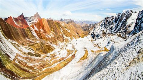 A sweeping view into the Andes Mountains from Vinicunca Mountain, Peru ...