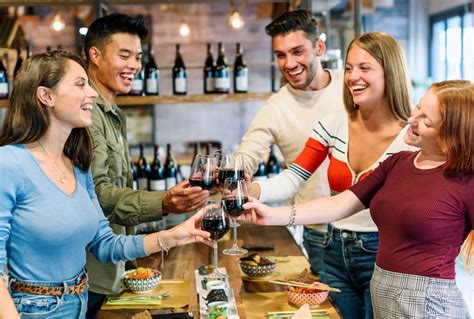 Premium Photo Group Of Excited Happy Young Friends Sharing A Toast