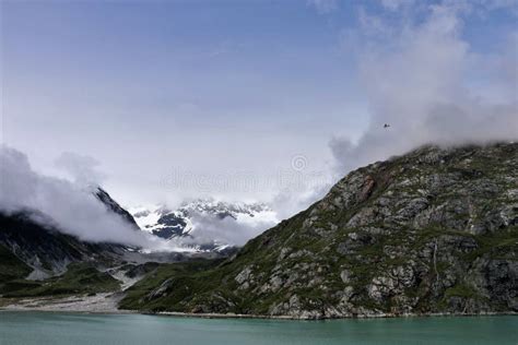 Plane Flying in Mountains in Glacier National Park Alaska Stock Image ...