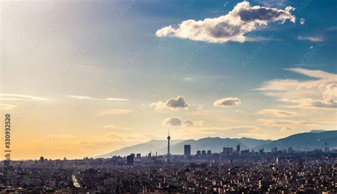 Tehran skyline in a beautiful cloudy day with golden hour light Tehran-Iran cityscape with Milad ...