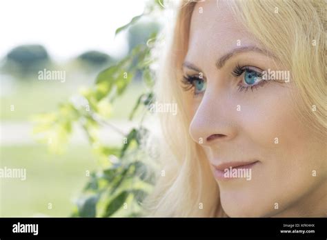 Pretty Romantic Blonde Woman In The City Park On A Spring Sunny Day