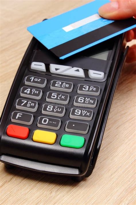 Hand Of Woman Paying With Contactless Credit Card With Nfc Technology