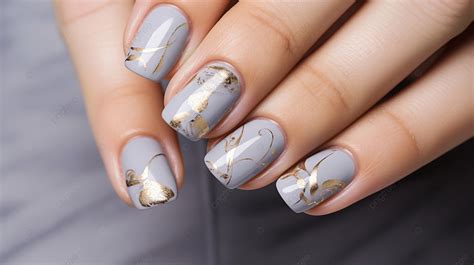 Well Groomed Womans Hands With Christmas Nail Design On Marble Gray