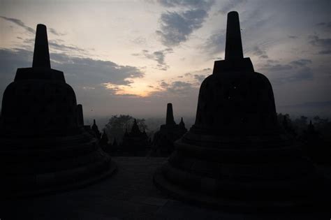 Premium Photo | Stupas at borobudur temple against sky