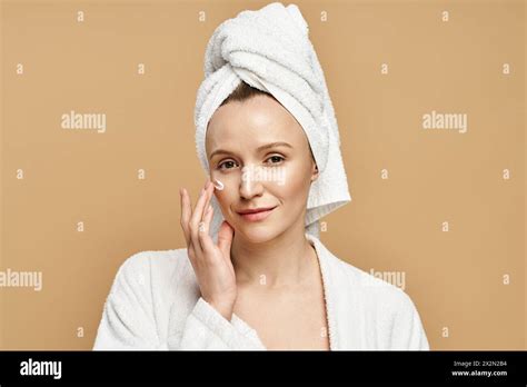 An Attractive Woman With Natural Beauty Elegantly Posing With A Towel