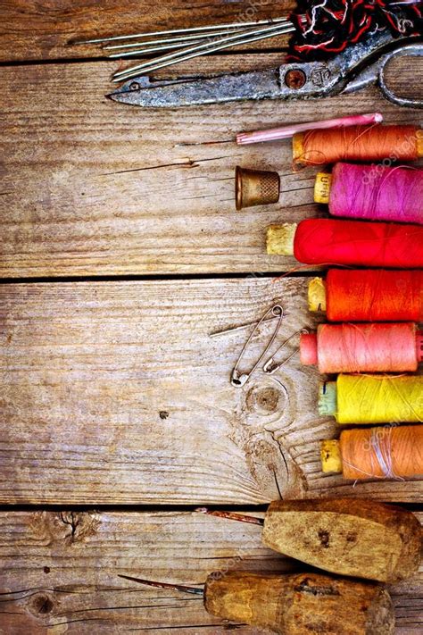 Colorful Threads And Old Scissors On The Old Wooden Table Stock Photo