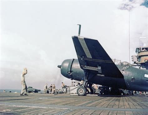 Aboard Uss Cape Gloucester Cve 109 A Plane Director Uses Arm Signals