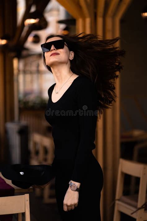 Photo Of Brunette Lady Posing On Wooden Background In Cafe Fashion