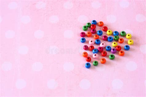 Colorful Heart Shape Made Of Beads On Pink Vintage Background Stock