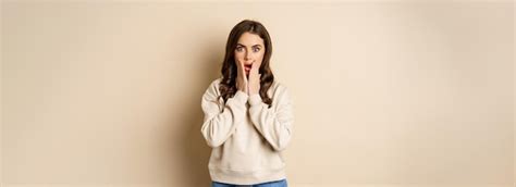 Premium Photo Portrait Of Shocked Brunette Woman Drop Jaw Gasping And