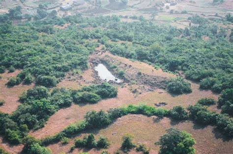 Drone Shot Of A Small Pond In The Middle Of A Forest In India Stock