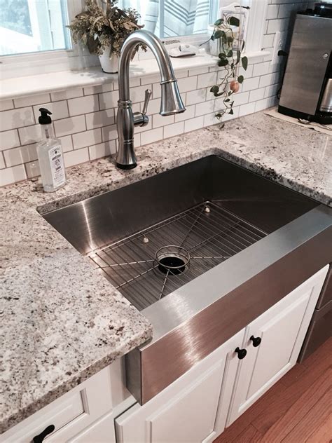 White kitchen cabinet makeover with stainless steel farmhouse sink ...