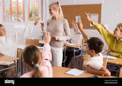 Kids Raising Hands In Class Hi Res Stock Photography And Images Alamy