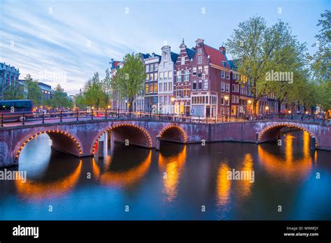 Famous Amstel river and night view of beautiful Amsterdam city ...