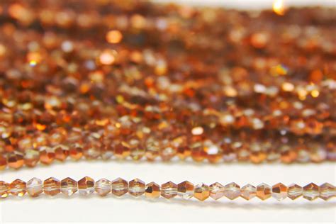 2mm Demi Coated Rose Gold Crystal Bicones Bead Spider