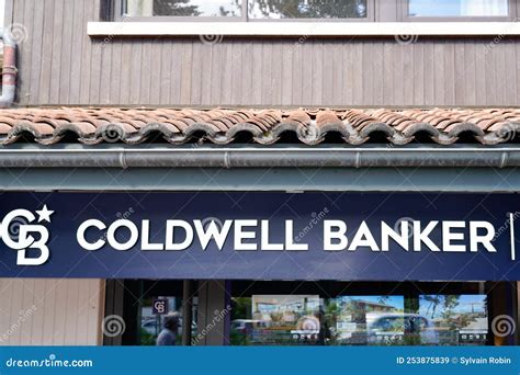 Coldwell Banker Sign Logo And Brand Text Cb On Building Facade Real