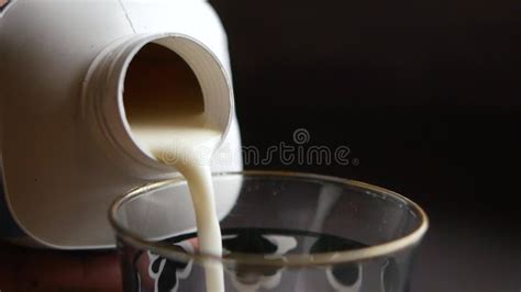 Slow Motion Of Pouring Milk From A Container Close Up Stock Footage