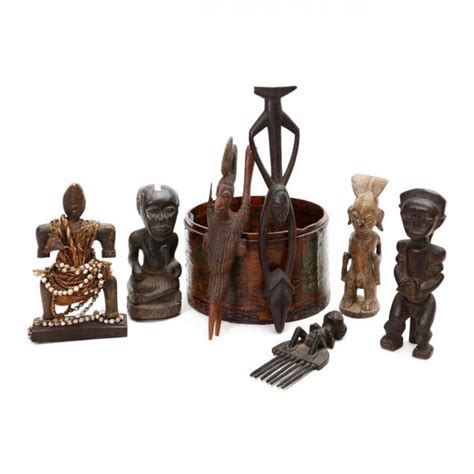 Seven Figural African Carvings And A Basket Lot 2399 The Collection