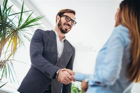 Young Business People Shaking Hands in the Office. Stock Image - Image of occupation, ideas ...