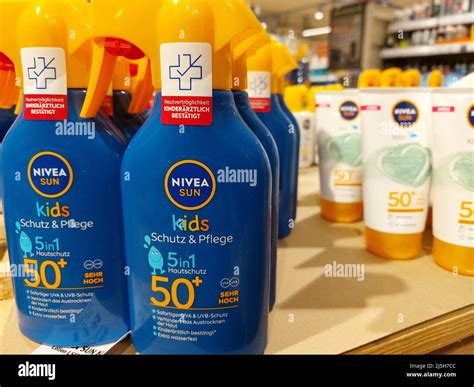 Nivea sunscreen spray in a supermarket Stock Photo - Alamy