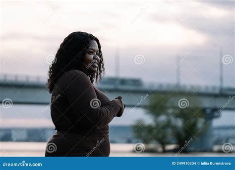 Curly Black Haired Cute Smiling And Pleasant Plump Afro American