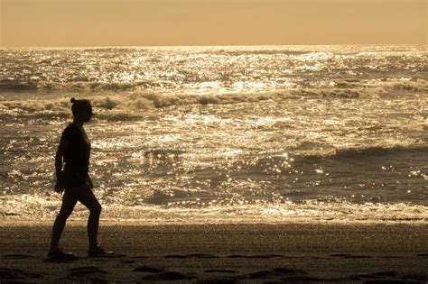 Silhouette of Girl at Sunset Editorial Stock Image - Image of walking ...