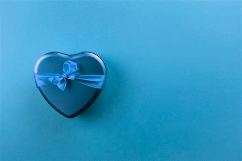 Premium Photo Blue Heart Shaped Box With Ribbon On Blue Background