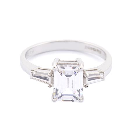 9ct White Gold Emerald Cut Cubic Zirconia And Cubic Zirconia Shoulders Ring