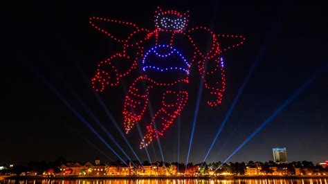 A Large Group Of Buildings With Fireworks In The Sky Above Them