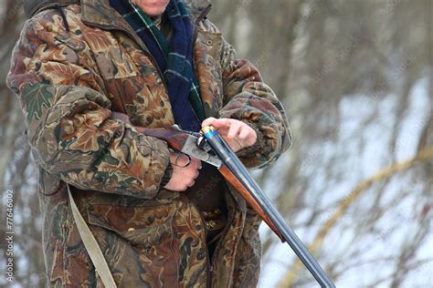 hunter loading his old double-barreled side by side shotgun Stock Photo ...